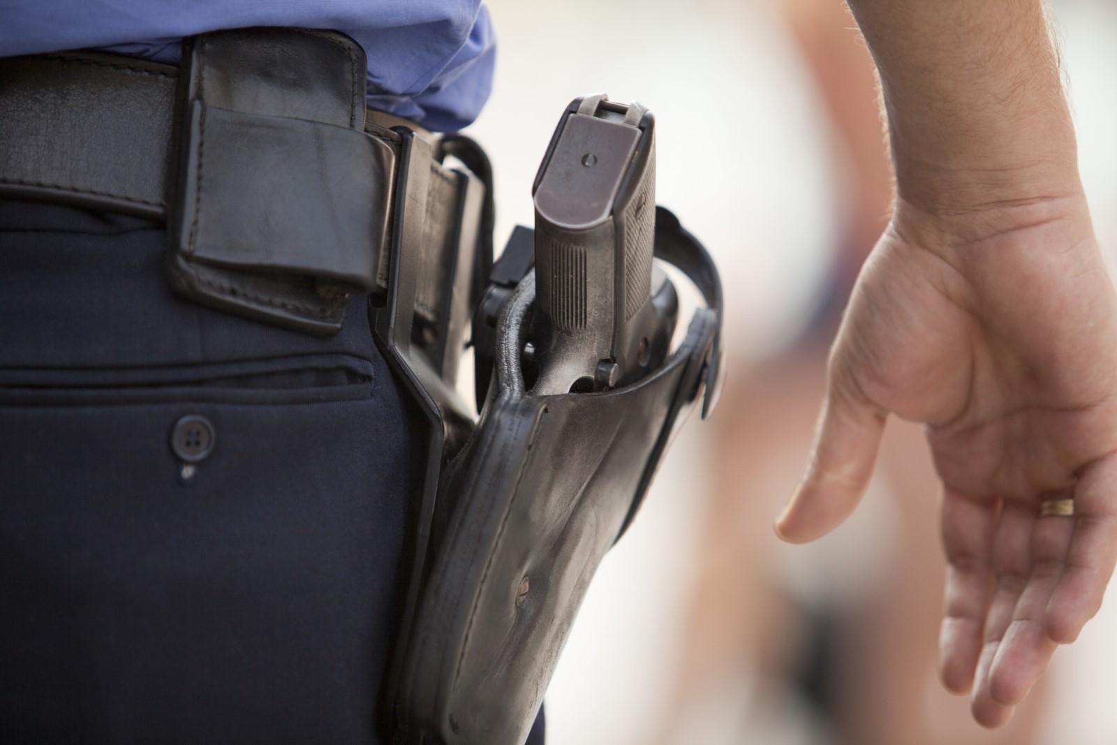 A close-up of a police officer's holster

Description automatically generated